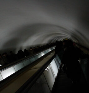 Exploring Pyongyang Metro: Curved tunnel with moving walkway, daily ridership up to 700,000.