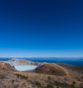 Majestic Mount Shirane: Volcanic beauty with emerald crater lake in Japan.