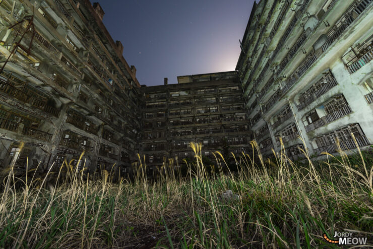 Abandoned urban landscape on Gunkanjima: Block 65 at night.