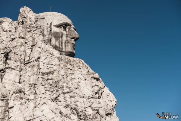 Abandoned Mount Rushmore replica in haunting Western Village theme park.