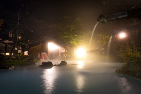 Tranquil Forest Onsen: Awanoyu Bubble Bath Experience in a serene natural setting.