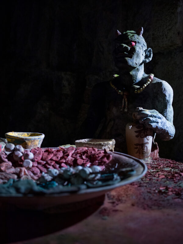 Surreal mythical creature sculpture with fruit bowl