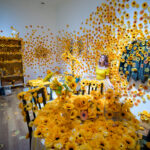 Yayoi Kusamas captivating sunflower installation immerses visitors.