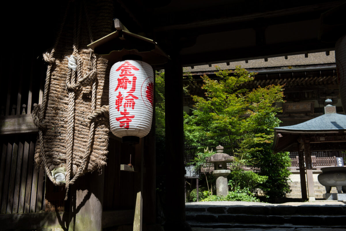 Paper lantern at Kongōrin-ji Temple gate, Shiga, Japan, overlooking serene courtyard