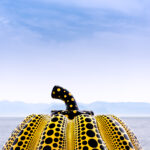 Yellow polka dot pumpkin sculpture on Naoshima Island overlooking the Seto Inland Sea