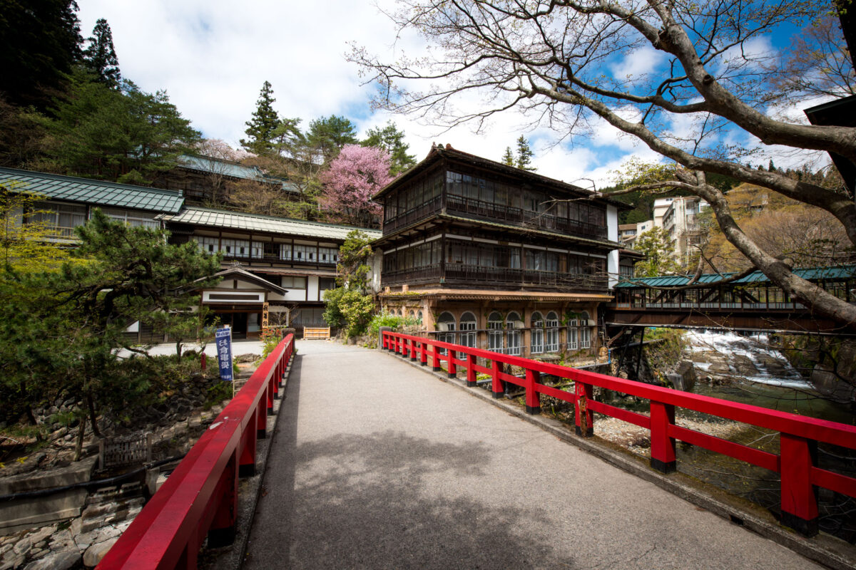 Sekizenkan Ryokan historic Japanese inn with iconic red bridge in mountain setting