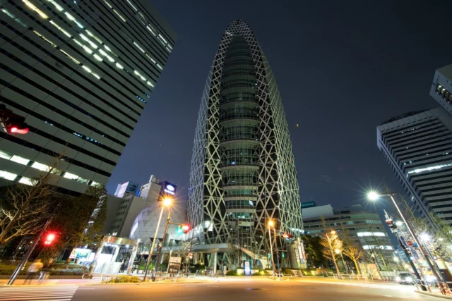 Cocoon tower glows, In Tokyo’s vibrant nightscape— Dreams weave through its lights. \n繭塔が光る、 東京の輝く夜景— 夢が光に織り込む。\n#ModeGakuenCocoonTower #TokyoNights #FuturisticDesign #UrbanDreams #CoolBlueGlow #ArchitecturalMarvel #OffbeatJapan #Japan