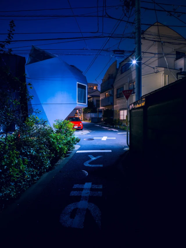 Blue under shadows, Modern shapes meet aged whispers— Neon dreams linger. 青い影に、 現代と古の形が交わり— ネオンの夢。 #urbanjapan #neonnight #cityscape #offbeatjapan #japan #nightphotography #surrealcity #architecturecontrast